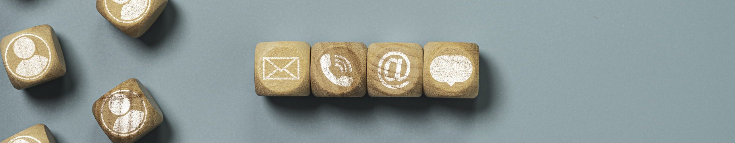 Customer service and business contact concept, wooden cube block which print screen letter , telephone email address and message.